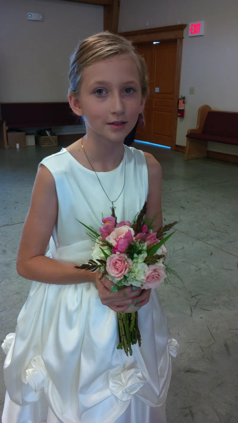 a pink and white nosegay bouquet for the flower girl.